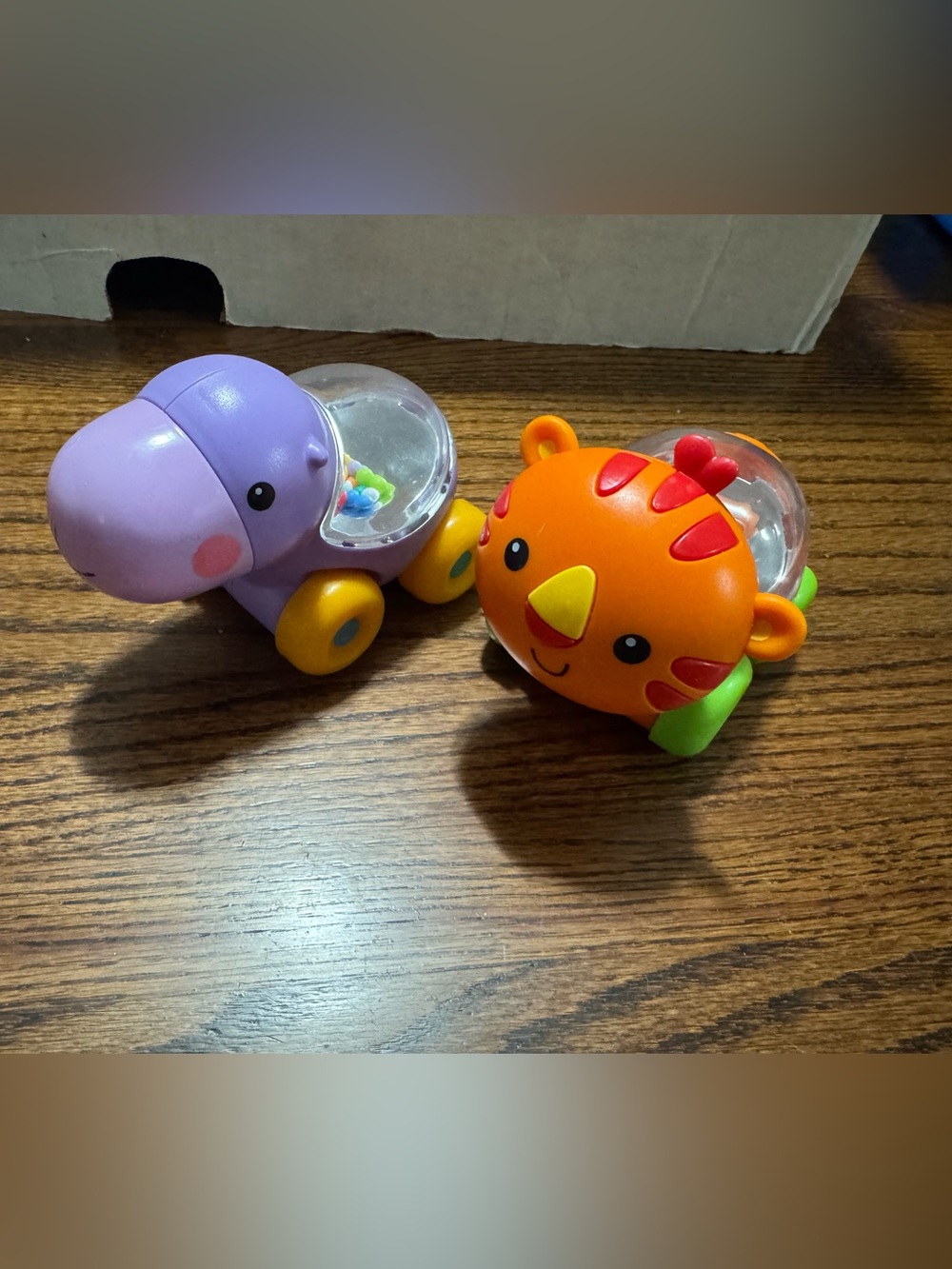 Lot of 2 Fisher Price Purple Hippo and Orange Lion Baby Rattle Set
